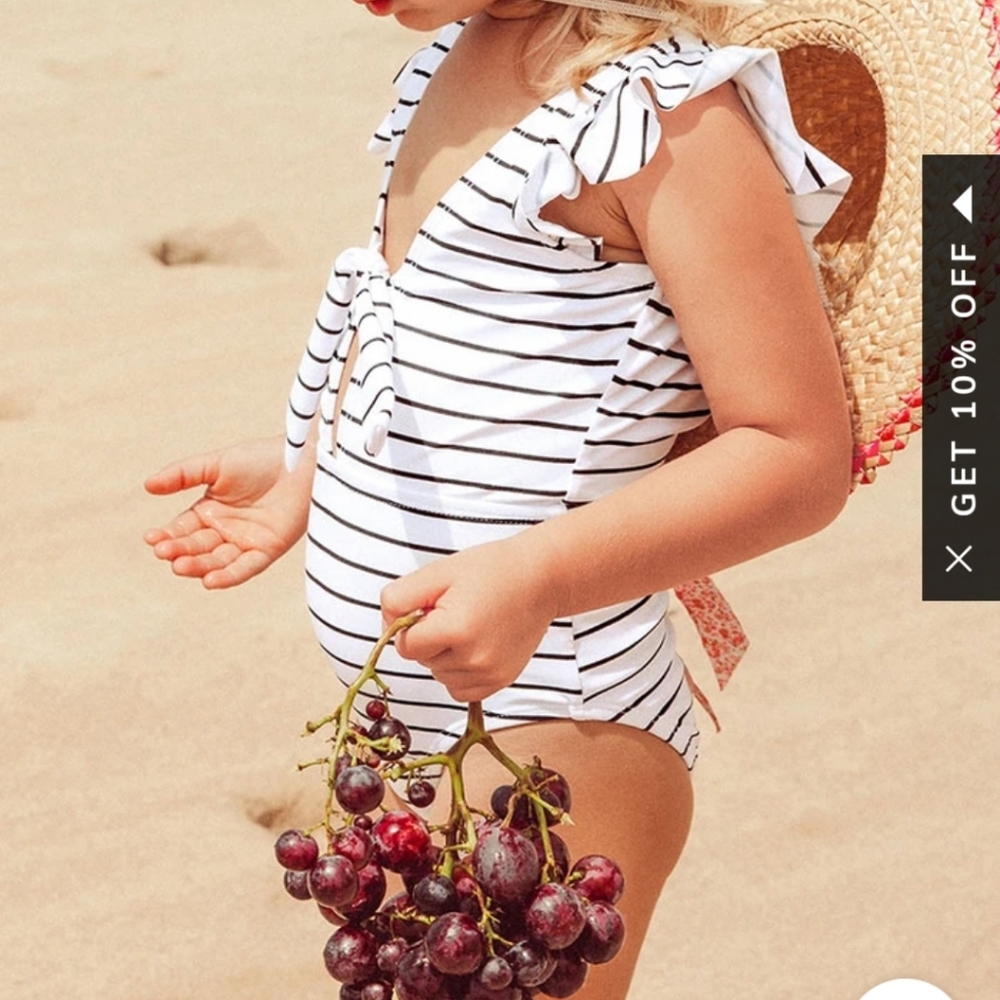 Girls size 6 black and white striped swimsuit